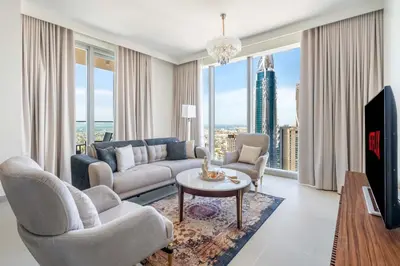 a living room with a couch and a table at GuestReady - Forte Tower | Steps from Dubai Mall in Dubai