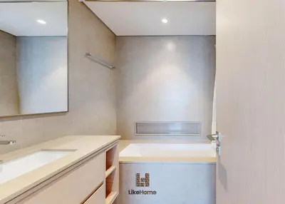 a bathroom with a sink and a mirror at Wake Up to Burj Khalifa Views Next to Dubai Mall Luxury 2BR Downtown Like Home in Dubai