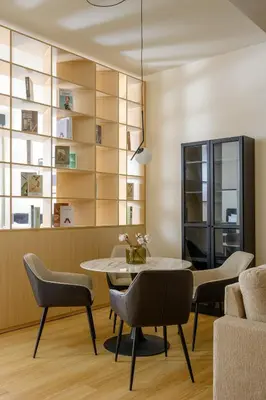 a dining room with a table and chairs at Stylish Studio Apartment in JVC in Dubai