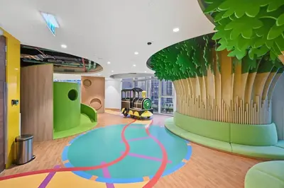a childrens play room with a train on the floor at Stunning 1BR Luxury Downtown Burj View Balcony in Dubai