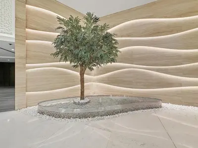 a tree in a room with a wall at Stunning 1BR Luxury Downtown Burj View Balcony in Dubai