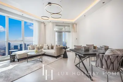 a living room with a couch and a table at LUX The Dubai Marina View Suite 3 in Dubai