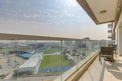 a balcony with a view of a city at Red Residence, Sports City - 2 Bedroom Apartment - Allsopp & Allsopp in Dubai