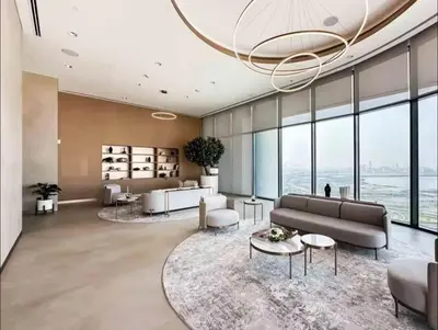 a large living room with a large chandelier at Crest haven suite in Dubai