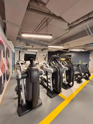 a gym with a row of treadmills at DT Penthouse • 250sqm • Billiards • Terrace & Pool in Dubai