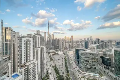 a view of a large city with tall buildings at DT Penthouse • 250sqm • Billiards • Terrace & Pool in Dubai