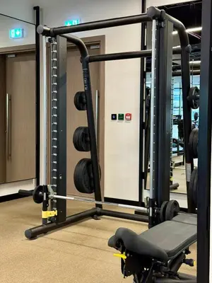 a gym with a tread machine in a room at 3BR Ultra Luxury Waterfront Panoramic Views with Pool, Gym, Jacuzzi -10 mins to Burj Khalifa in Dubai
