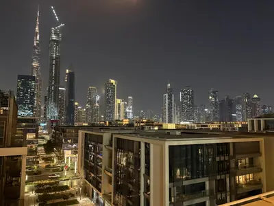 a view of a city skyline at night at Stylish 1BR in CityWalk, Stunning Burj Khalifa view in Dubai