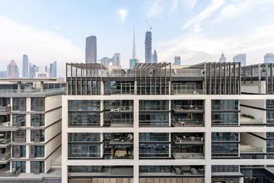 an office building with a view of the city at Stylish 1BR in CityWalk, Stunning Burj Khalifa view in Dubai