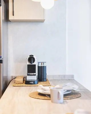 a coffee maker sitting on a counter in a kitchen at Bay Central Marina Suite with Exceptional Views in Dubai