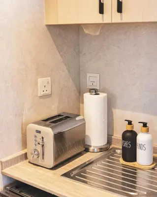 a kitchen counter with a toaster and a toaster at Bay Central Marina Suite with Exceptional Views in Dubai