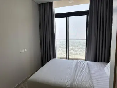a bedroom with a bed and a large window at Skyline 2BR - AYKON CITY Tower C-Business Bay 5101 in Dubai