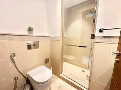 a bathroom with a toilet and a shower at Luxury 2BR with Full Burj Khalifa View in Dubai