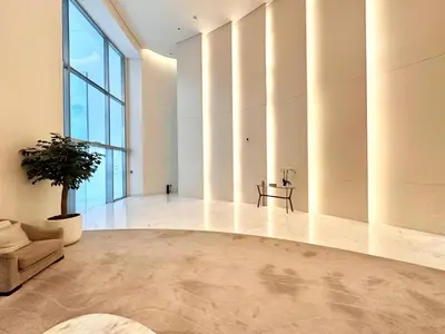 a living room with a couch and a table at Luxury 2BR with Full Burj Khalifa View in Dubai