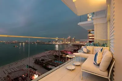 a balcony of a building with a view of the water at Luxurious 4BR La Vie JBR Private Beach Pool Panoramic Sea and Dubai Eye Views Drone Show Perfect for Family and Friends in Dubai