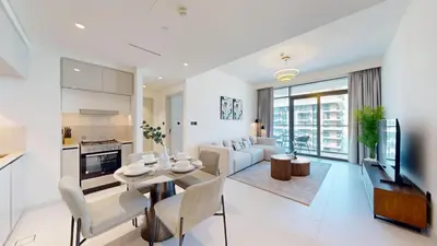 a living room with a couch and a table at Vacationer l Stunning 1 Bed l Sea View l Private Beach Access in Dubai
