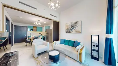 a living room with a couch and a table at Vacationer l Elegant 1 Bedroom l Arjan l Pool with View Deck in Dubai