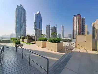 a balcony with a view of a city with tall buildings at Vacationer l Contemporary 1 Bed l City Views l near Circle Mall in Dubai
