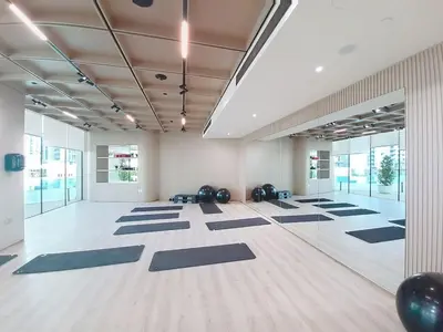a large room with yoga mats on the floor at Vacationer l Modern 1 Bed l Private Pool l Community Views in Dubai
