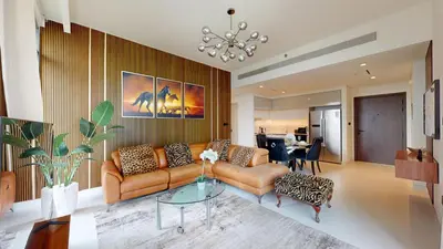 a living room with a couch and a table at Vacationer l Classic 2 Bedroom l Marina Views l Private Beach in Dubai