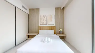 a bedroom with a bed with two white pillows at Vacationer l Classic 2 Bedroom l Marina Views l Private Beach in Dubai