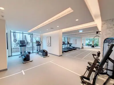 a gym with treadmills and exercise equipment in a room at Vacationer l Classic 2 Bedroom l Marina Views l Private Beach in Dubai