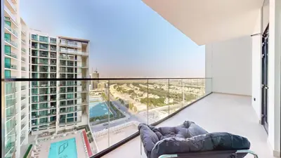 a living room with a couch and a large window at Vacationer l Classy 2 Bedroom l Private Jacuzzi l near Circle Mall in Dubai