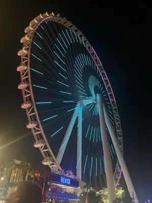 a large ferris wheel in a city at night at Spacious 1 Bedroom Apartment-Opal Tower Dubai Marina in Dubai