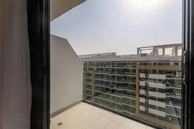 a view of a large building from a window at Roomook Cozy studio in Dubai