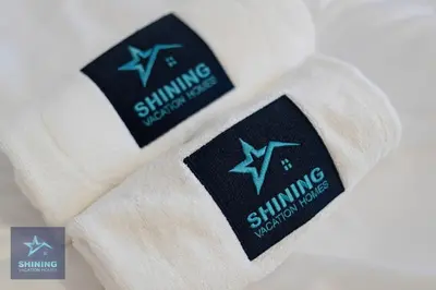 a pair of white socks with a star on them at Modern 1BR Apartment in JVC Pool Gym Near Circle Mall in Dubai