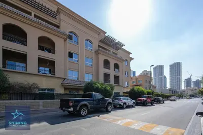 a black truck parked in front of a building at Modern 1BR Apartment in JVC Pool Gym Near Circle Mall in Dubai