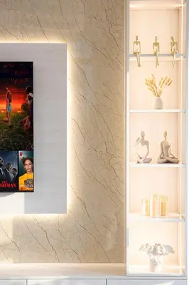 a book shelf with a picture of a movie at Highest Infinity Pool - Paramount Midtown Hotel & Luxury Apartments Burj Khalifa view & Partial Fountain View in Dubai
