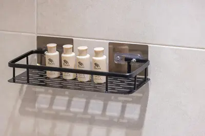 a shelf on a wall with five white bottles on it at Highest Infinity Pool - Paramount Midtown Hotel & Luxury Apartments Burj Khalifa view & Partial Fountain View in Dubai