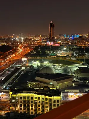 a view of a city at night with lights at Magra CHILL SPOT HOSTEL in Sabkhah