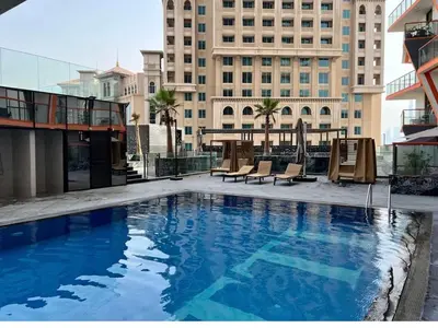 a large swimming pool on top of a building at Magra CHILL SPOT HOSTEL in Sabkhah