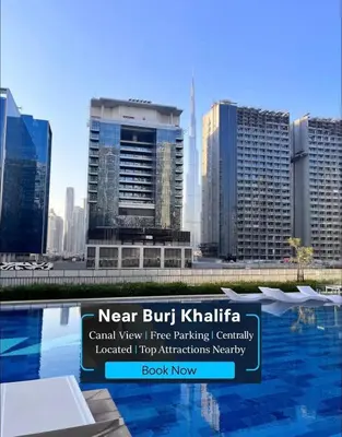 a view of a city with tall buildings at Luxury 2BR Downtown Apartment - Canal & City Views in Dubai