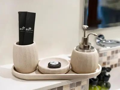 a bathroom counter with two toothbrushes and toothpaste at Charming & Cozy 1BR Burj Khalifa Skyline View in Dubai