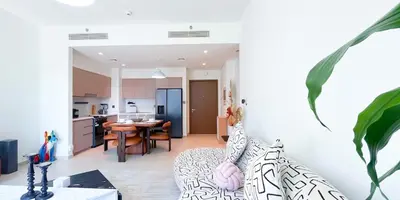 a room with a kitchen and a dining room at Luxury in Dubai 2 bedroom apartment with balcony in Dubai