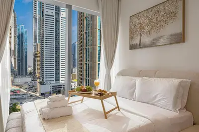 a living room with a view of a city at Livin' Holidays - 1 BR - Paradise getaway Dubai Marina in Dubai