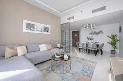 a living room with a couch and a table at Picture-Perfect Canal and City Views, Minutes from Waterfront Transport, Easy Access to Downtown Delights, Prive by Damac B, Business Bay by Deluxe Holiday Homes in Dubai
