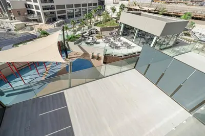 an overhead view of a building with glass windows at Modern Studio in Business Bay in Dubai