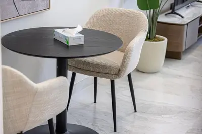 a table with a chair and a box of tissues at Modern Studio in Business Bay in Dubai