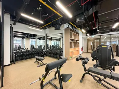 a gym with a lot of exercise equipment in it at Modern Studio in Business Bay in Dubai