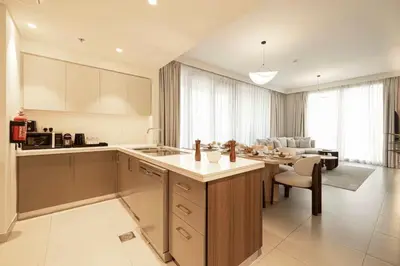 a kitchen with a counter and a dining room at the space in Dubai