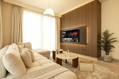 a living room with a white couch and a tv at the space in Dubai
