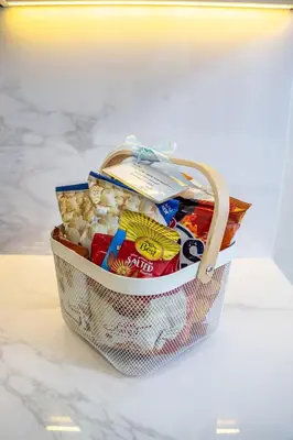 a basket filled with candy on top of a counter at Airstay - Bright Top-Floor 1BR - Azizi Riviera 8 - Monthly Offer Available! in Dubai