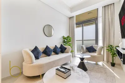 a living room with a couch and a table at Bookable 1 Bed Aykon City with Amazing Bird eye view in Dubai