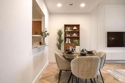 a dining room with a table and chairs at Elegant 3 BR - Stunning Burj Khalifa Views in Dubai