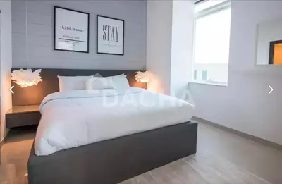 a bedroom with a large white bed and a window at Prime Location - Dubai Marina 1br - King Size Bed in Dubai