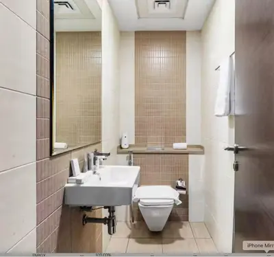 a bathroom with a sink and a toilet and a mirror at Prime Location - Dubai Marina 1br - King Size Bed in Dubai